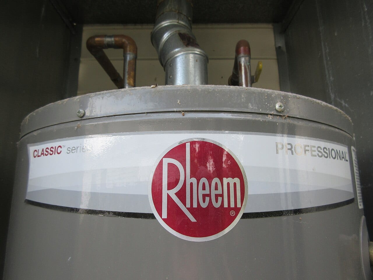 Storage water heater with copper supply connections and vent